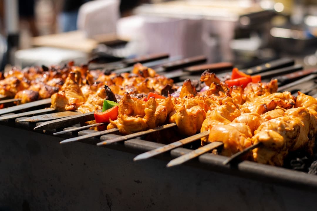 indian bbq catering sizzling tandoori skewers over live charcoal