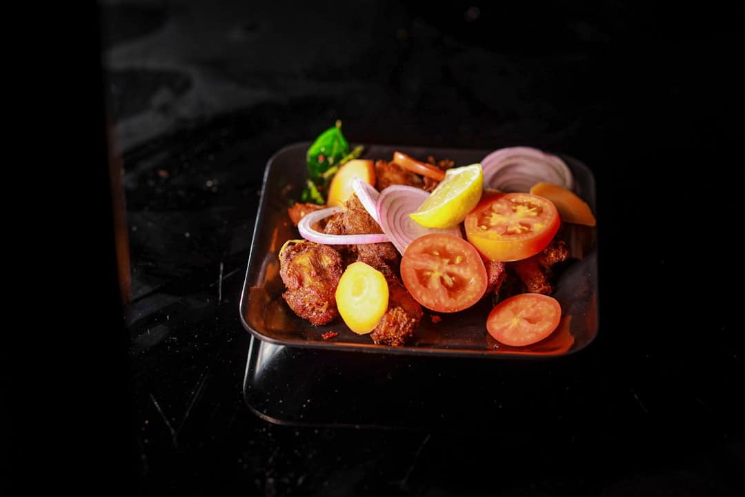 tandoori chicken takeaway sizzling on platter