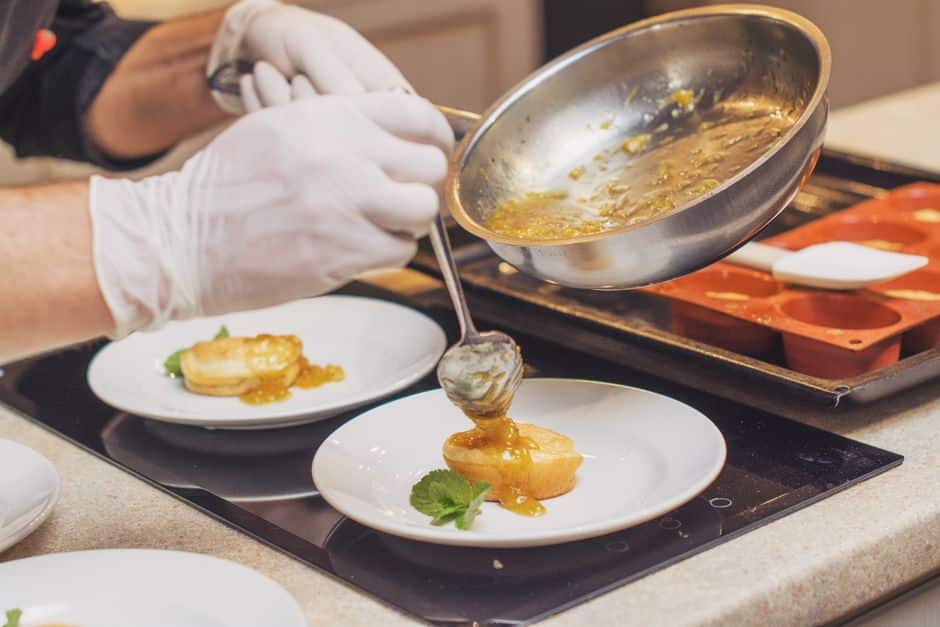 chef plating an exquisite tasting menu course